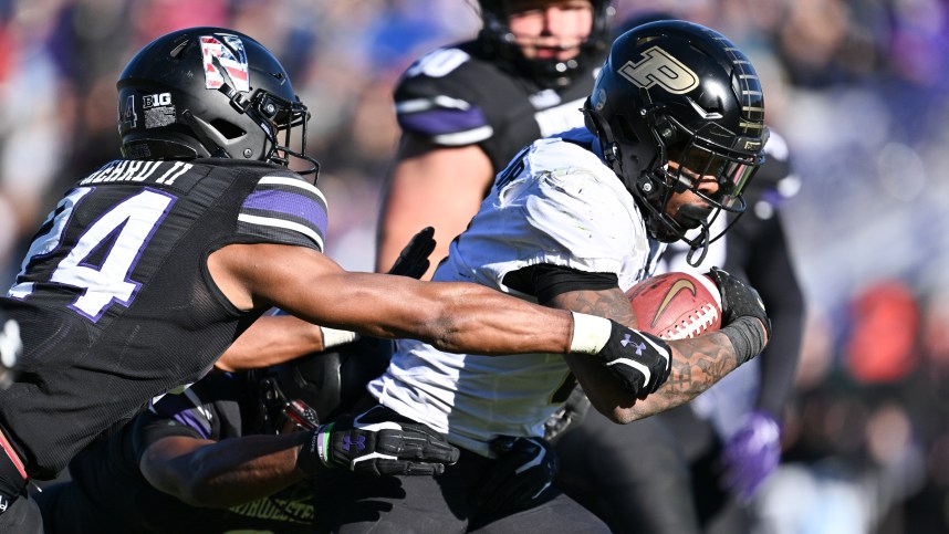Nov 18, 2023; Evanston, Illinois, USA; Purdue Boilermakers running back Tyrone Tracy Jr. (3)(New York Giants) breaks a tackle by Northwestern Wildcats defensive back Rod Heard II (24) for a touchdown run in the third quarter at Ryan Field. Mandatory Credit: Jamie Sabau-USA TODAY Sports