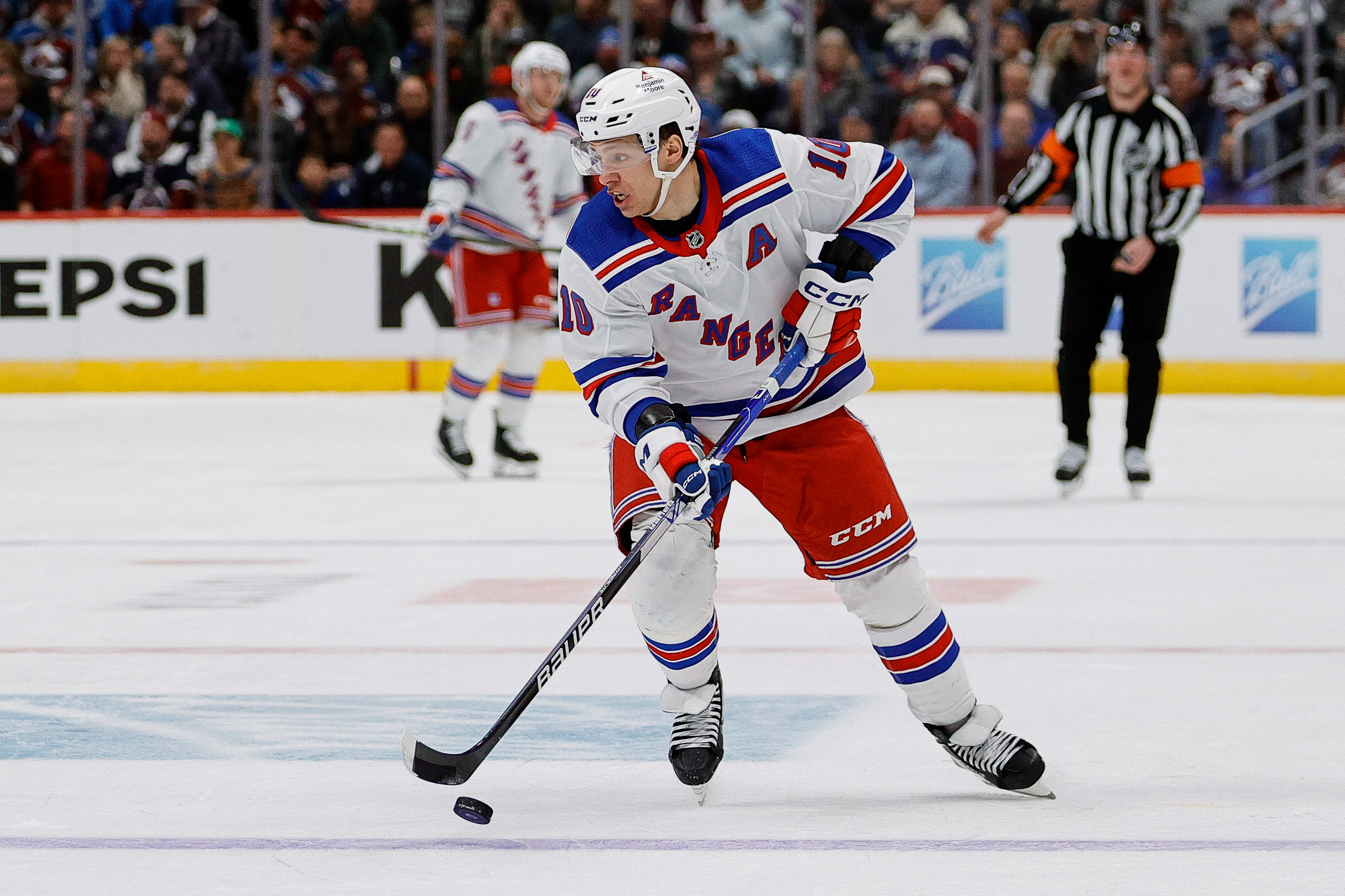 New York Rangers left wing Artemi Panarin (10) controls the puck in the third period against the Colorado Avalanche at Ball Arena