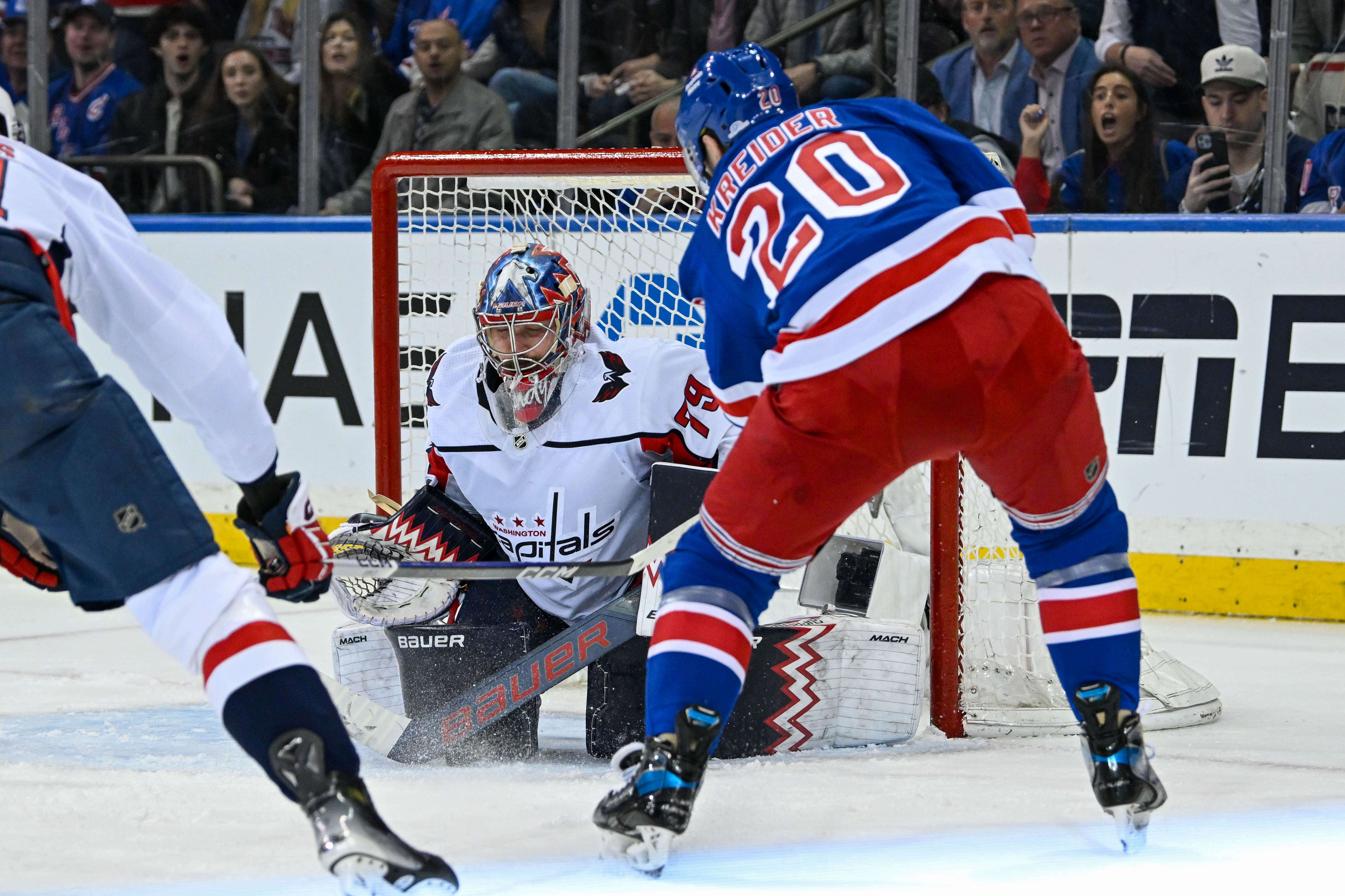 Apr 23, 2024; New York, New York, USA; Washington Capitals goaltender Charlie Lindgren (79) makes a save on New York Rangers left wing Chris Kreider (20) during the third period in game two of the first round of the 2024 Stanley Cup Playoffs at Madison Square Garden. Mandatory Credit: Dennis Schneidler-USA TODAY Sports