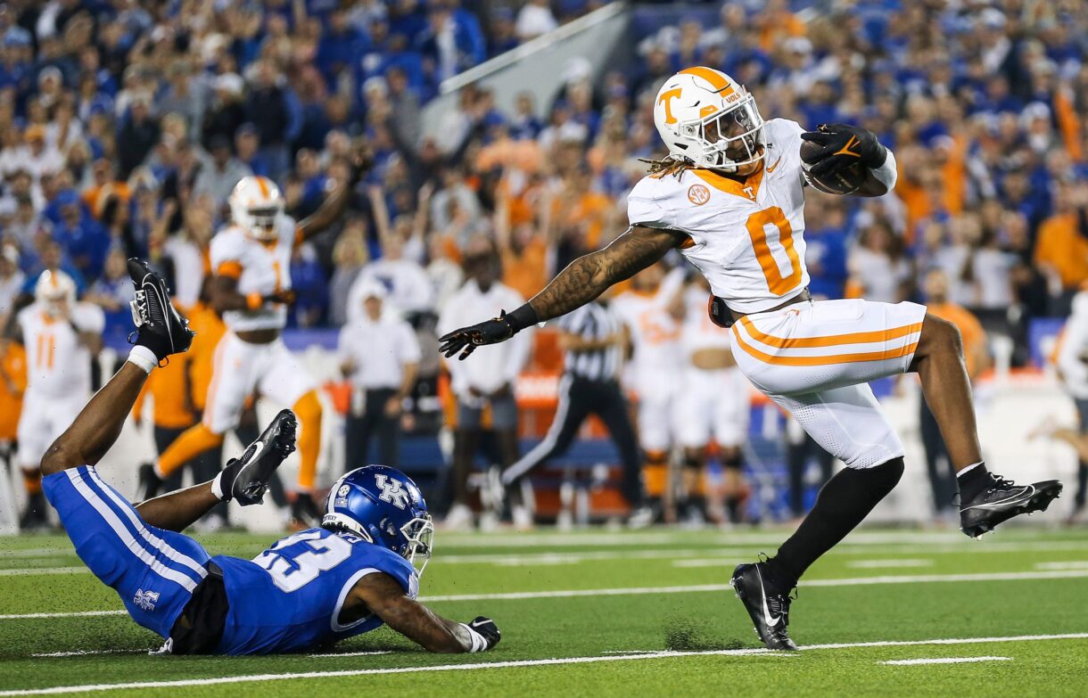 Tennessee Volunteers running back Jaylen Wright (New York Giants prospect) (0) dodges Kentucky Wildcats defensive back Andru Phillips (23) to strike first with a Volunteer touchdown early in the first quarter Saturday in Lexington. Oct. 28, 2023.