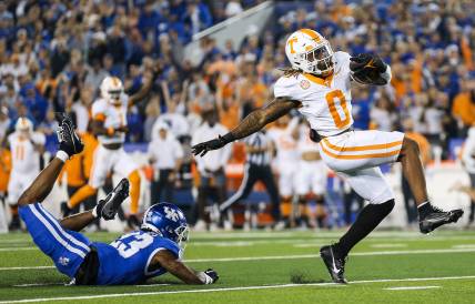 Tennessee Volunteers running back Jaylen Wright (New York Giants prospect) (0) dodges Kentucky Wildcats defensive back Andru Phillips (23) to strike first with a Volunteer touchdown early in the first quarter Saturday in Lexington. Oct. 28, 2023.