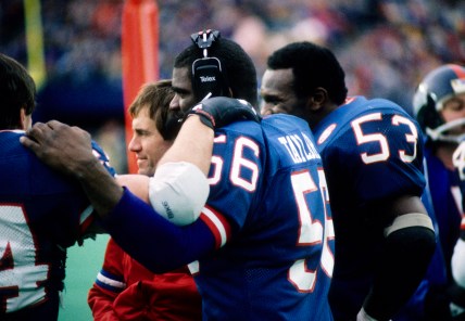 Jan 4, 1987; E. Rutherford, NJ, USA; FILE PHOTO; New York Giants linebacker Lawrence Taylor (56) and Harry Carson (53) on the sideline with assistant coach Bill Belichick during the 1986 NFC Divisional Playoff Game at Giants Stadium. Mandatory Credit: Malcolm Emmons-USA TODAY Sports
