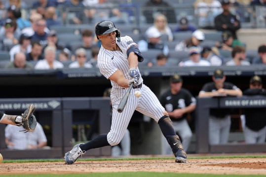 May 18, 2024; Bronx, New York, USA; New York Yankees designated hitter Giancarlo Stanton (27) hits a solo home run against the Chicago White Sox during the third inning at Yankee Stadium. Mandatory Credit: Brad Penner-USA TODAY Sports