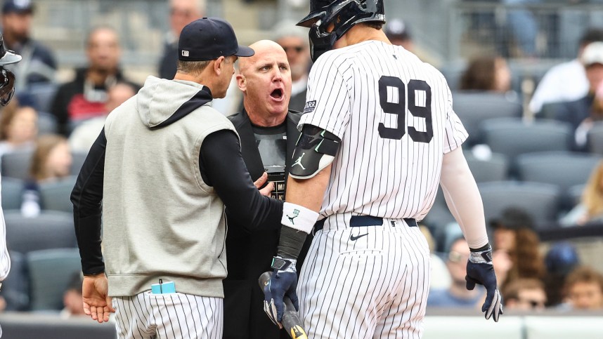May 4, 2024; Bronx, New York, USA;  New York Yankees center fielder Aaron Judge (99) and manager Aaron Boone (17) argue with home plate umpire Ryan Blakney (36) in the seventh inning against the Detroit Tigers at Yankee Stadium. Mandatory Credit: Wendell Cruz-USA TODAY Sports