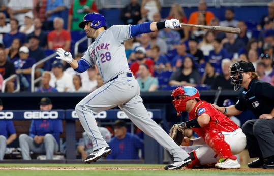 May 18, 2024; Miami, Florida, USA;  New York Mets designated hitter J.D. Martinez (28) singles in a run against the Miami Marlins in the first inning at loanDepot Park. Mandatory Credit: Rhona Wise-USA TODAY Sports