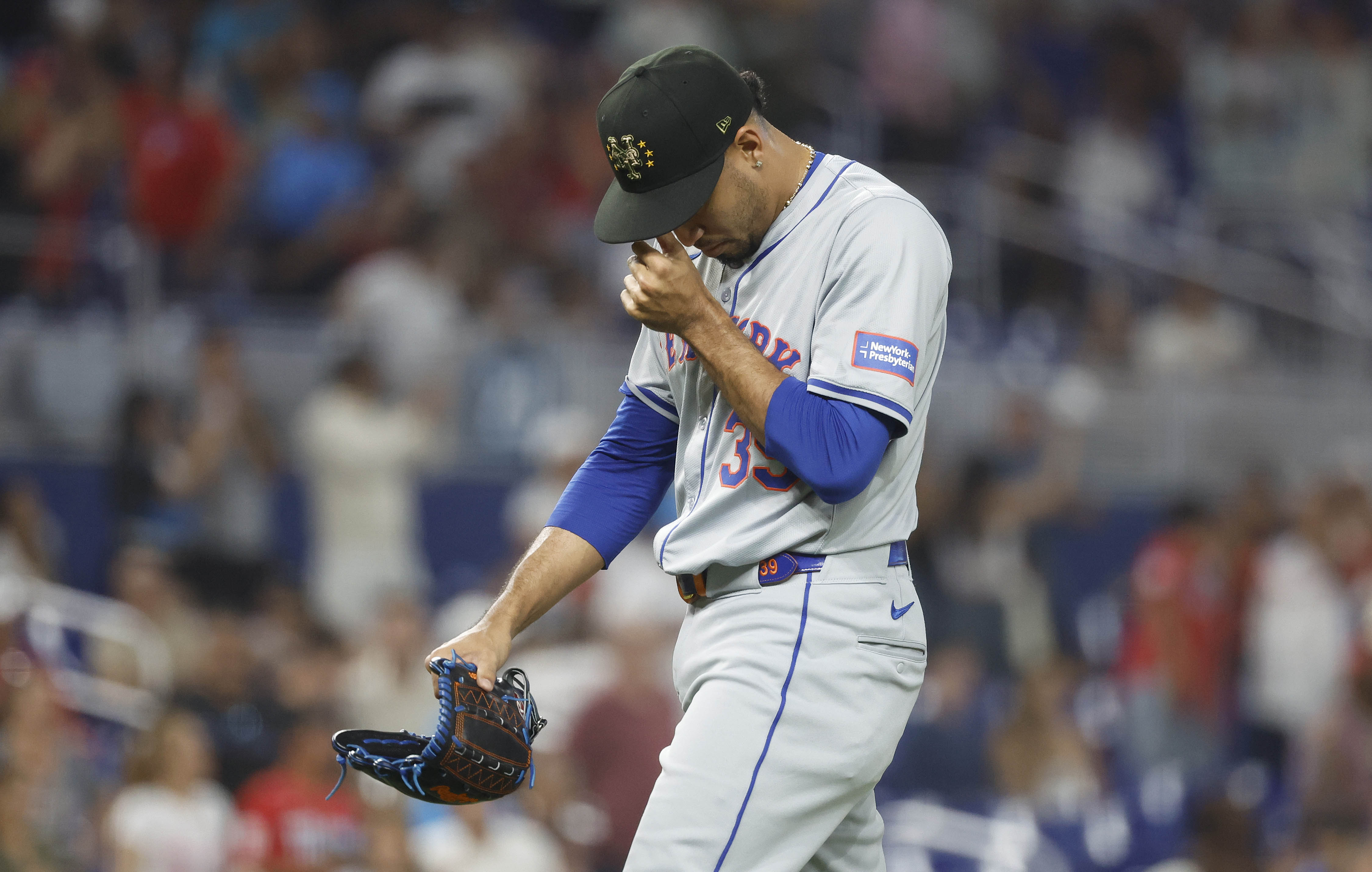 May 18, 2024; Miami, Florida, USA; New York Mets relief pitcher Edwin Diaz (39) reacts as he leaves the mound after giving up four runs against the Miami Marlins in the ninth inning at loanDepot Park. Mandatory Credit: Rhona Wise-USA TODAY Sports