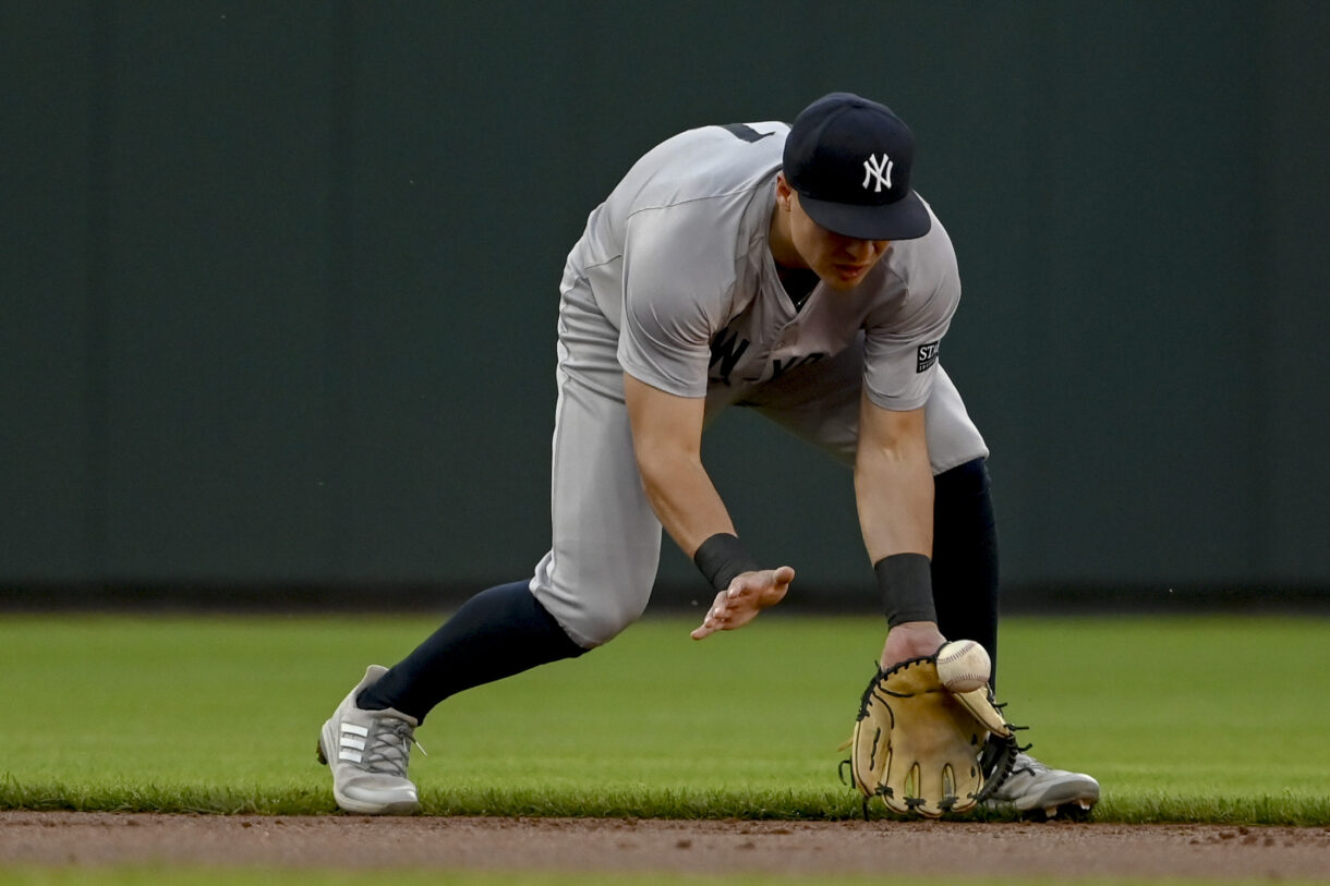 May 1, 2024; Baltimore, Maryland, USA; New York Yankees shortstop Anthony Volpe (11) fields a ground ball during the first inning against the Baltimore Orioles  at Oriole Park at Camden Yards. Mandatory Credit: Tommy Gilligan-USA TODAY Sports
