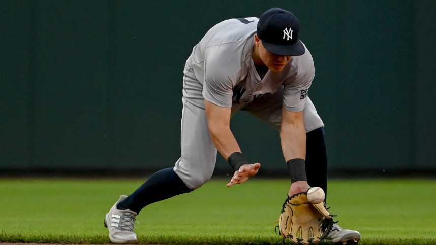 May 1, 2024; Baltimore, Maryland, USA; New York Yankees shortstop Anthony Volpe (11) fields a ground ball during the first inning against the Baltimore Orioles  at Oriole Park at Camden Yards. Mandatory Credit: Tommy Gilligan-USA TODAY Sports