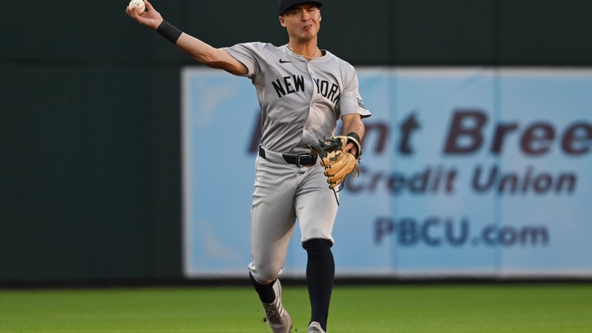 May 1, 2024; Baltimore, Maryland, USA;  New York Yankees shortstop Anthony Volpe (11) throws to first base during the first inning against the Baltimore Orioles at Oriole Park at Camden Yards. Mandatory Credit: Tommy Gilligan-USA TODAY Sports