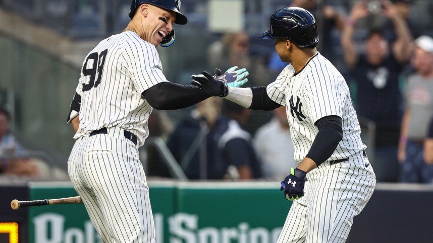May 22, 2024; Bronx, New York, USA;  New York Yankees right fielder Juan Soto (22) celebrates with center fielder Aaron Judge (99) after hitting a two-run home run in the third inning against the Seattle Mariners at Yankee Stadium. Mandatory Credit: Wendell Cruz-USA TODAY Sports