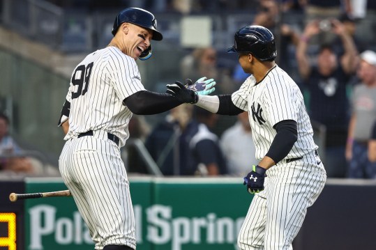May 22, 2024; Bronx, New York, USA;  New York Yankees right fielder Juan Soto (22) celebrates with center fielder Aaron Judge (99) after hitting a two-run home run in the third inning against the Seattle Mariners at Yankee Stadium. Mandatory Credit: Wendell Cruz-USA TODAY Sports
