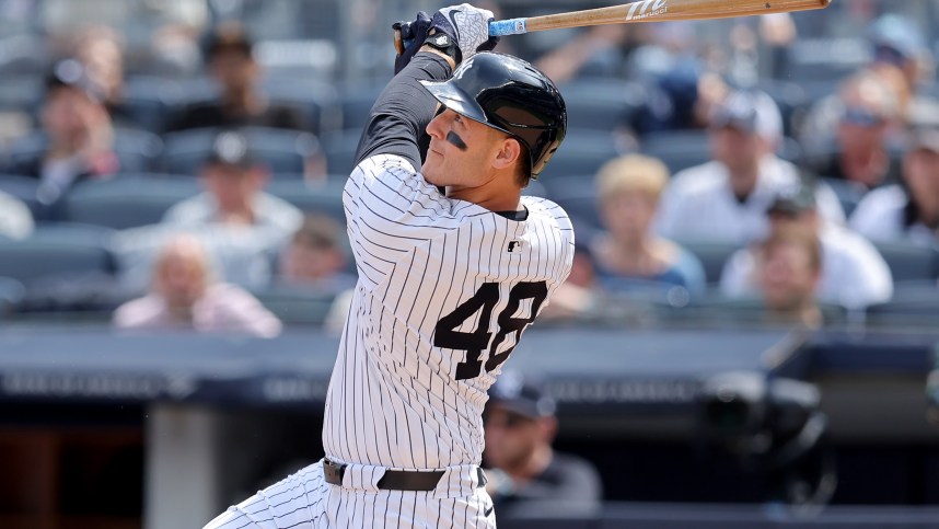 May 23, 2024; Bronx, New York, USA; New York Yankees first baseman Anthony Rizzo (48) follows through on an RBI sacrifice fly against the Seattle Mariners during the seventh inning at Yankee Stadium. Mandatory Credit: Brad Penner-USA TODAY Sports