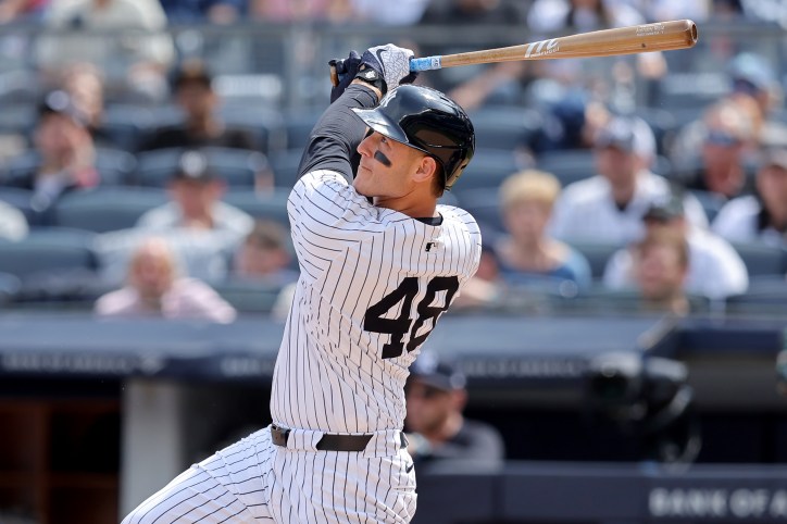 May 23, 2024; Bronx, New York, USA; New York Yankees first baseman Anthony Rizzo (48) follows through on an RBI sacrifice fly against the Seattle Mariners during the seventh inning at Yankee Stadium. Mandatory Credit: Brad Penner-USA TODAY Sports