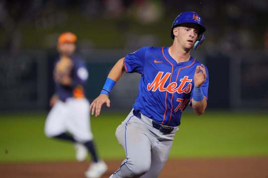 Mar 16, 2024; West Palm Beach, Florida, USA;  New York Mets shortstop Zack Short (74) rounds third base and scores a run on a base hit in the sixth inning against the Houston Astros at CACTI Park of the Palm Beaches. Mandatory Credit: Jim Rassol-USA TODAY Sports