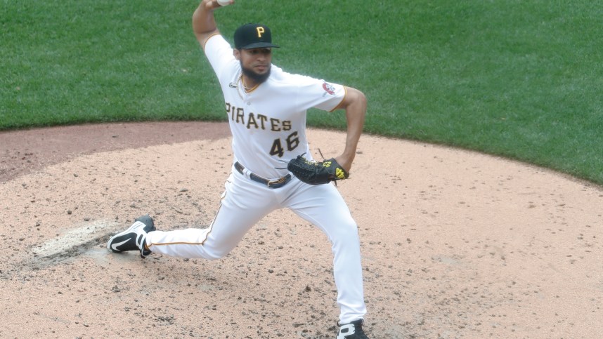 Aug 23, 2023; Pittsburgh, Pennsylvania, USA;  Pittsburgh Pirates relief pitcher Yohan Ramirez (New York Mets) (46) pitches against the St. Louis Cardinals during the fourth inning at PNC Park. Mandatory Credit: Charles LeClaire-USA TODAY Sports
