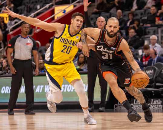 Mar 20, 2024; Detroit, Michigan, USA; Detroit Pistons guard Evan Fournier (31) drives to the basket in front of Indiana Pacers forward Doug McDermott (20) in the first half at Little Caesars Arena. Mandatory Credit: David Reginek-USA TODAY Sports
