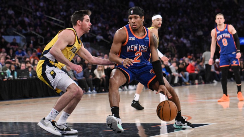 Feb 10, 2024; New York, New York, USA; New York Knicks guard Miles McBride (2) drives to the basket while being defended by Indiana Pacers guard T.J. McConnell (9) during the third quarter at Madison Square Garden. Mandatory Credit: John Jones-USA TODAY Sports