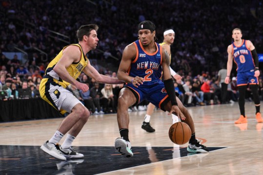 Feb 10, 2024; New York, New York, USA; New York Knicks guard Miles McBride (2) drives to the basket while being defended by Indiana Pacers guard T.J. McConnell (9) during the third quarter at Madison Square Garden. Mandatory Credit: John Jones-USA TODAY Sports