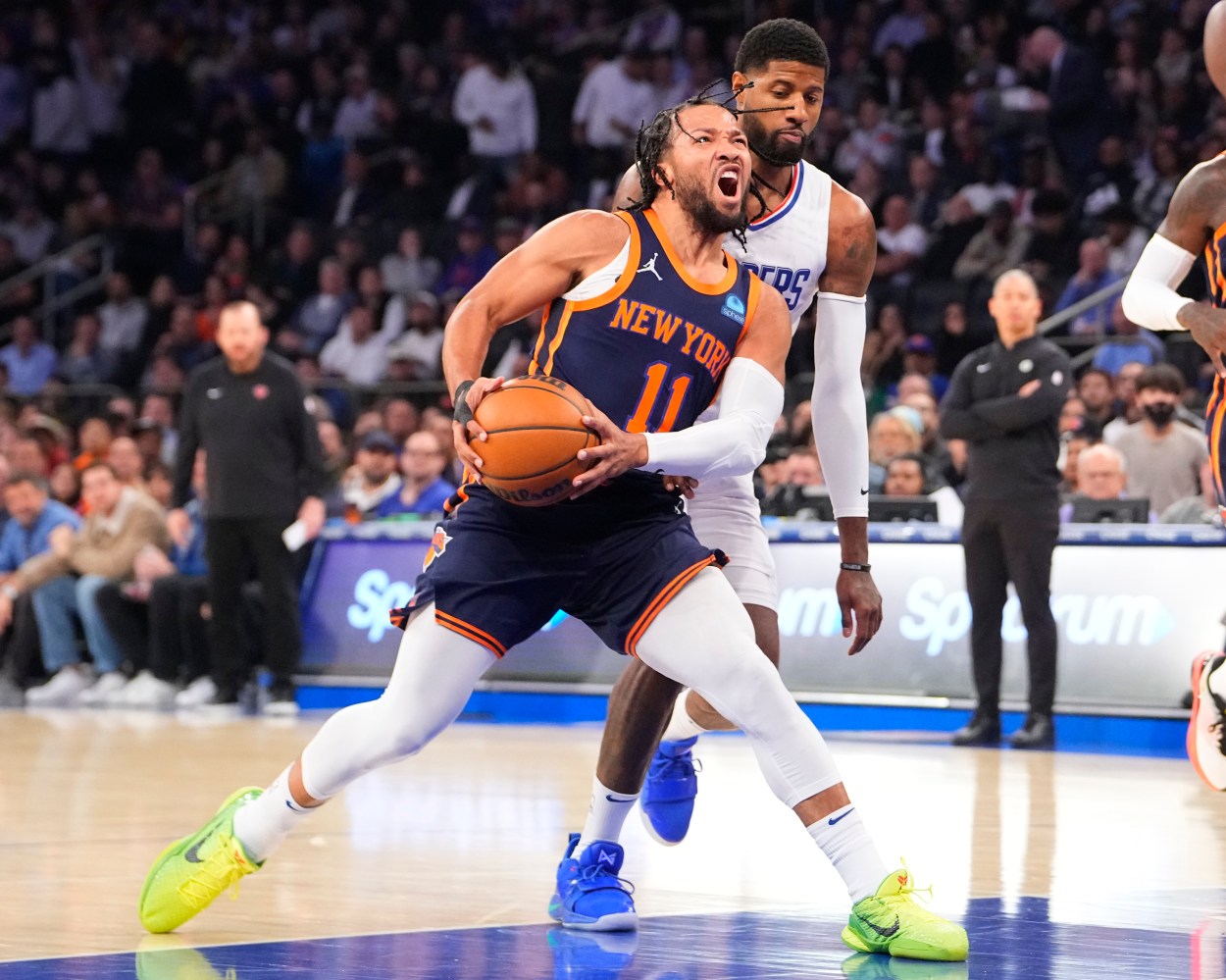 Nov 6, 2023; New York, New York, USA;  New York Knicks point guard Jalen Brunson (11) drives the ball towards the basket against Los Angeles Clipper forward Paul George (13) during the first quarter at Madison Square Garden. Mandatory Credit: Gregory Fisher-USA TODAY Sports