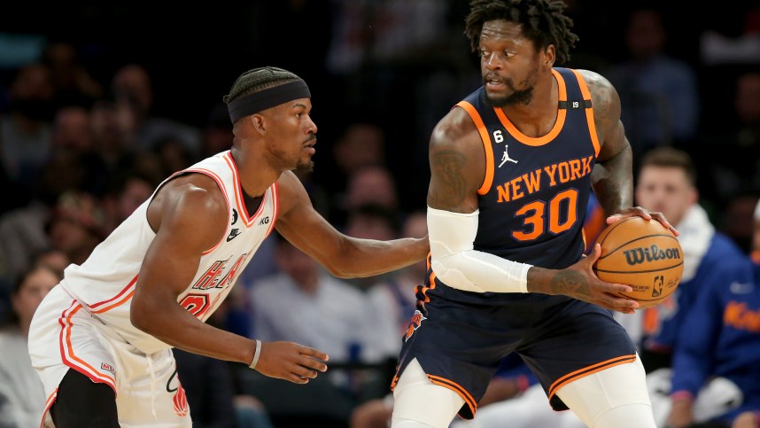 Mar 29, 2023; New York, New York, USA; New York Knicks forward Julius Randle (30) controls the ball against Miami Heat forward Jimmy Butler (22) during the first quarter at Madison Square Garden. Mandatory Credit: Brad Penner-USA TODAY Sports