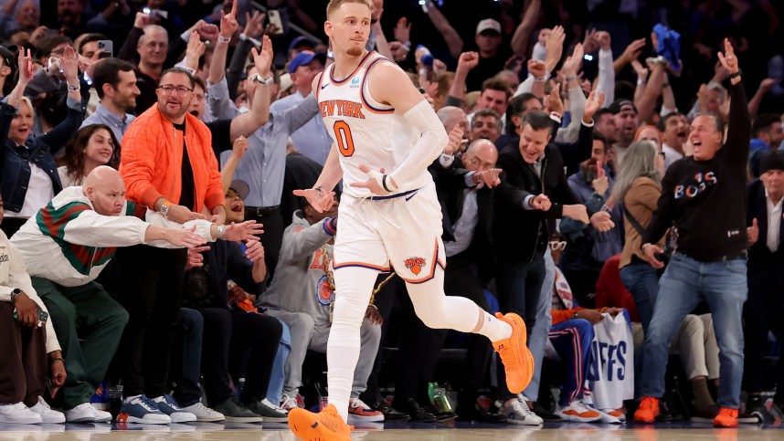 May 6, 2024; New York, New York, USA; New York Knicks guard Donte DiVincenzo (0) celebrates his three point shot against the Indiana Pacers during the fourth quarter of game one of the second round of the 2024 NBA playoffs at Madison Square Garden. Mandatory Credit: Brad Penner-USA TODAY Sports