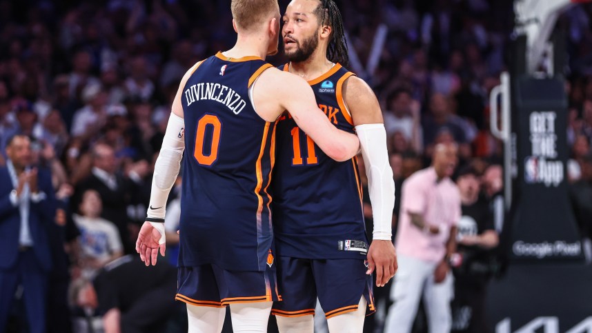 May 8, 2024; New York, New York, USA; New York Knicks guards Donte DiVincenzo (0) and Jalen Brunson (11) embrace after defeating the Indiana Pacers 130-121 in game two of the second round for the 2024 NBA playoffs at Madison Square Garden. Mandatory Credit: Wendell Cruz-USA TODAY Sports