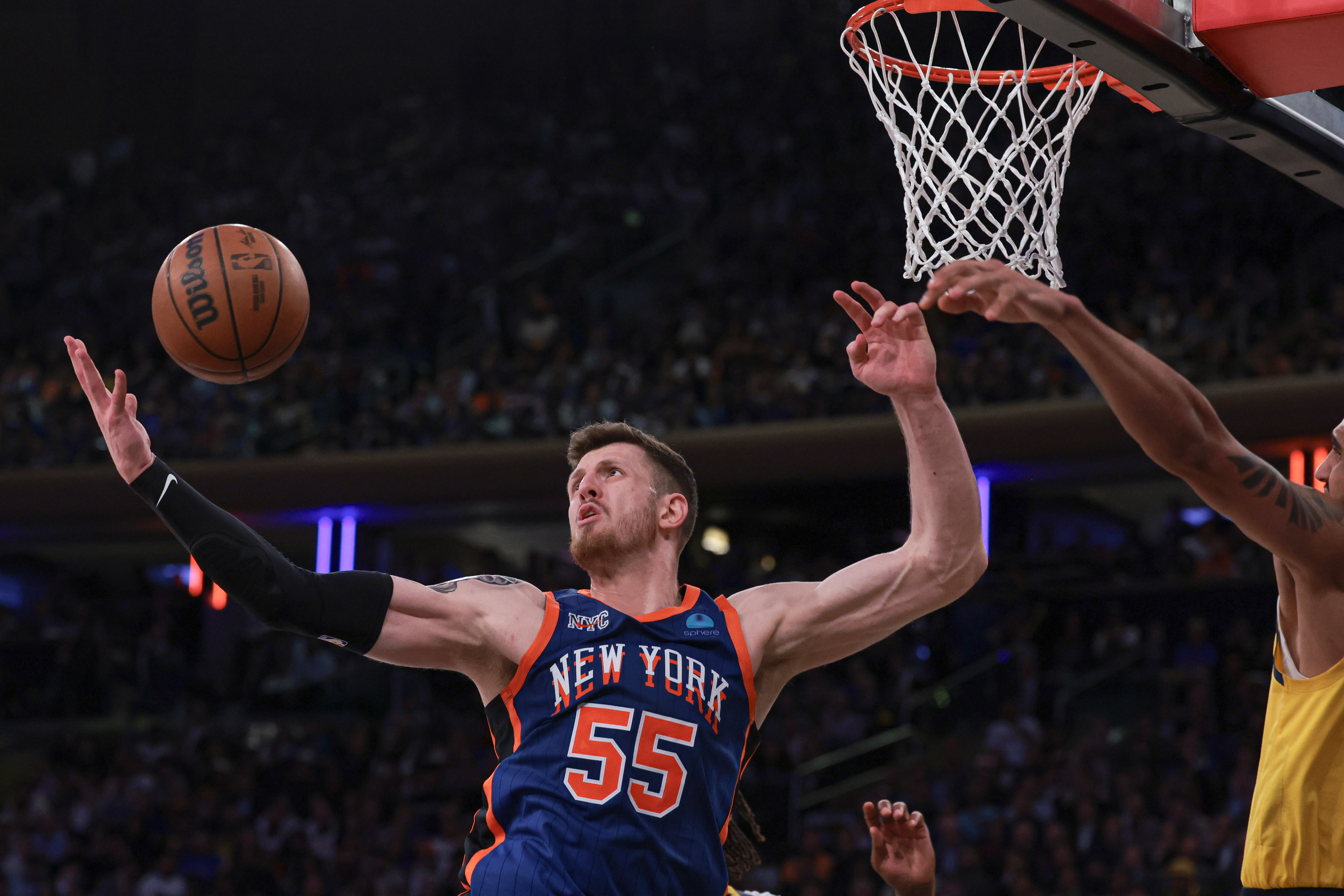 May 14, 2024; New York, New York, USA; New York Knicks center Isaiah Hartenstein (55) rebounds against Indiana Pacers forward Obi Toppin (1) during the second half during game five of the second round for the 2024 NBA playoffs at Madison Square Garden. Mandatory Credit: Vincent Carchietta-USA TODAY Sports