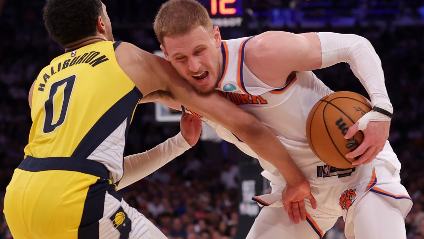May 19, 2024; New York, New York, USA; New York Knicks guard Donte DiVincenzo (0) is fouled by Indiana Pacers guard Tyrese Haliburton (0) during the fourth quarter of game seven of the second round of the 2024 NBA playoffs at Madison Square Garden. Mandatory Credit: Brad Penner-USA TODAY Sports