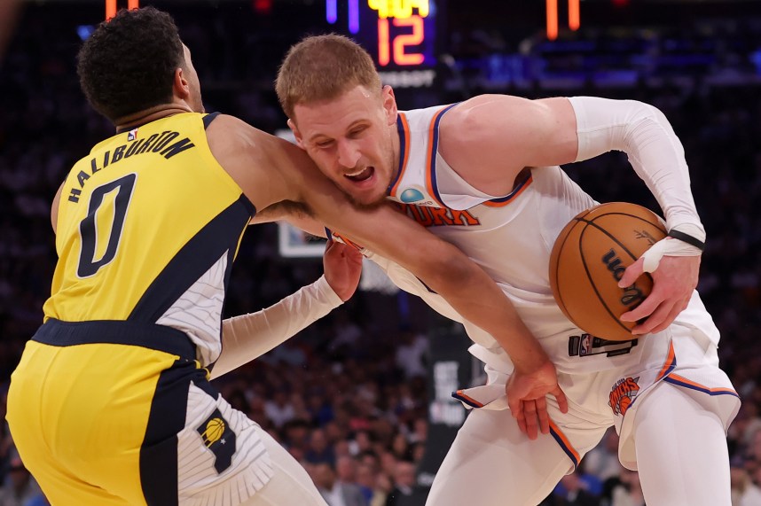 May 19, 2024; New York, New York, USA; New York Knicks guard Donte DiVincenzo (0) is fouled by Indiana Pacers guard Tyrese Haliburton (0) during the fourth quarter of game seven of the second round of the 2024 NBA playoffs at Madison Square Garden. Mandatory Credit: Brad Penner-USA TODAY Sports