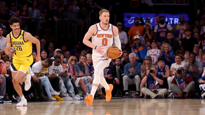 May 19, 2024; New York, New York, USA; New York Knicks guard Donte DiVincenzo (0) brings the ball up court against Indiana Pacers guard Ben Sheppard (26) during the fourth quarter of game seven of the second round of the 2024 NBA playoffs at Madison Square Garden. Mandatory Credit: Brad Penner-USA TODAY Sports