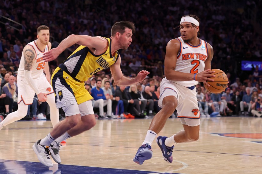 May 19, 2024; New York, New York, USA; New York Knicks guard Miles McBride (2) drives to the basket against Indiana Pacers guard T.J. McConnell (9) during the fourth quarter of game seven of the second round of the 2024 NBA playoffs at Madison Square Garden. Mandatory Credit: Brad Penner-USA TODAY Sports