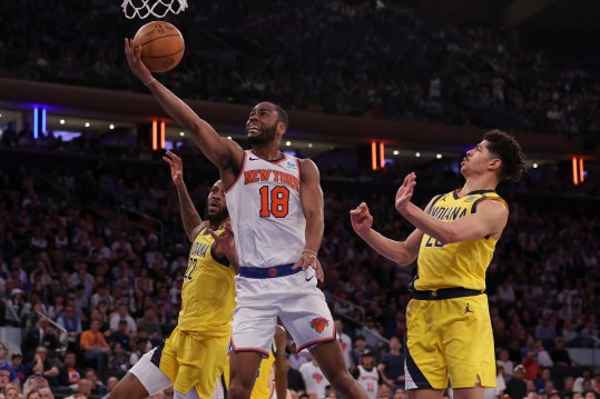 May 19, 2024; New York, New York, USA; New York Knicks guard Alec Burks (18) drives to the basket against Indiana Pacers forward Isaiah Jackson (22) and guard Ben Sheppard (26) during the fourth quarter of game seven of the second round of the 2024 NBA playoffs at Madison Square Garden. Mandatory Credit: Brad Penner-USA TODAY Sports