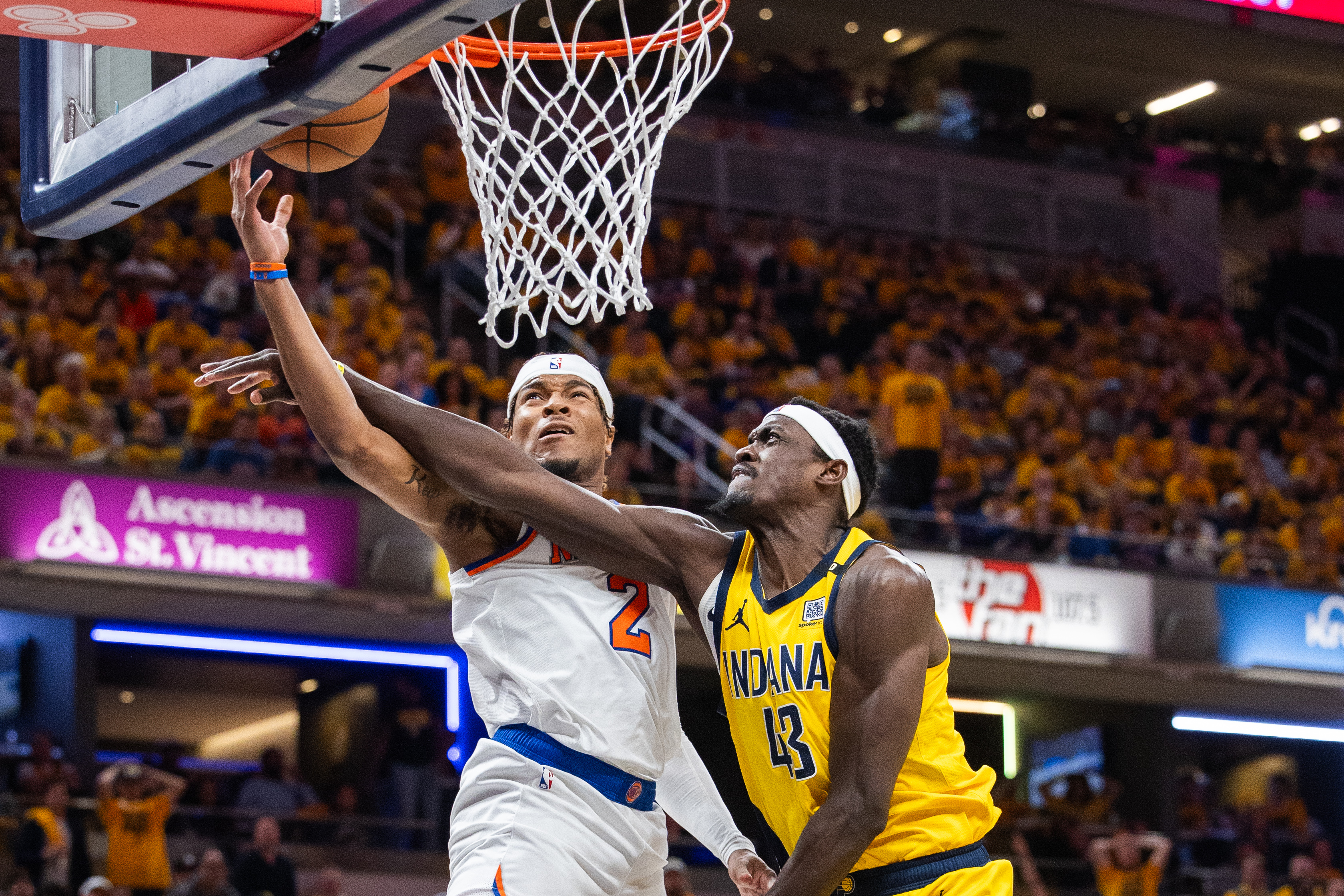 May 10, 2024; Indianapolis, Indiana, USA; New York Knicks guard Miles McBride (2) shoots the ball while Indiana Pacers forward Pascal Siakam (43) defends during game three of the second round for the 2024 NBA playoffs at Gainbridge Fieldhouse. Mandatory Credit: Trevor Ruszkowski-USA TODAY Sports