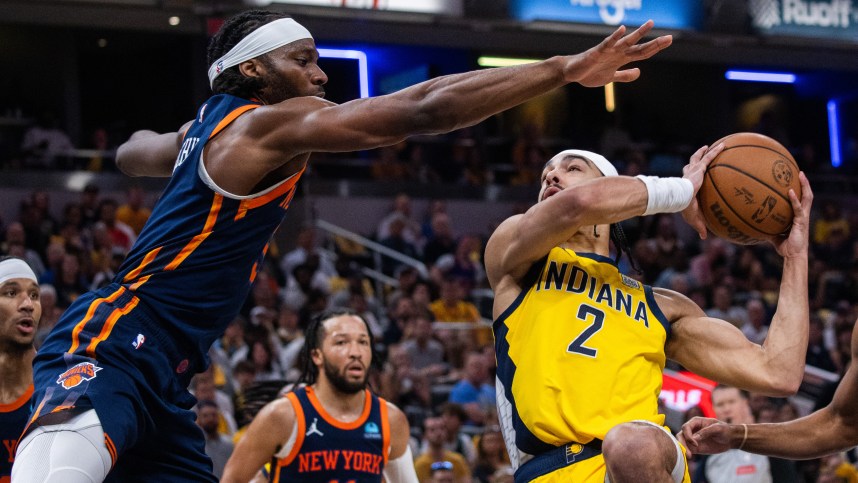 May 12, 2024; Indianapolis, Indiana, USA;  Indiana Pacers guard Andrew Nembhard (2) shoots the ball while New York Knicks forward Precious Achiuwa (5) defends during game four of the second round for the 2024 NBA playoffs at Gainbridge Fieldhouse. Mandatory Credit: Trevor Ruszkowski-USA TODAY Sports