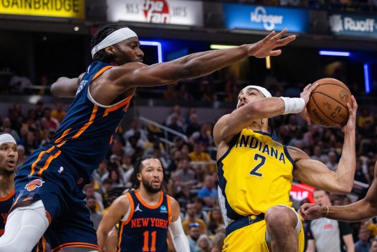 May 12, 2024; Indianapolis, Indiana, USA;  Indiana Pacers guard Andrew Nembhard (2) shoots the ball while New York Knicks forward Precious Achiuwa (5) defends during game four of the second round for the 2024 NBA playoffs at Gainbridge Fieldhouse. Mandatory Credit: Trevor Ruszkowski-USA TODAY Sports
