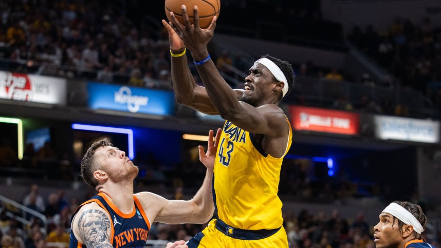 May 12, 2024; Indianapolis, Indiana, USA; Indiana Pacers forward Pascal Siakam (43) shoots the ball while New York Knicks center Isaiah Hartenstein (55) defends during game four of the second round for the 2024 NBA playoffs at Gainbridge Fieldhouse. Mandatory Credit: Trevor Ruszkowski-USA TODAY Sports