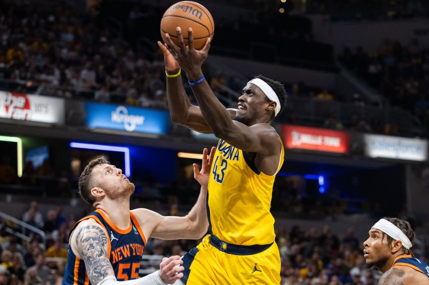 May 12, 2024; Indianapolis, Indiana, USA; Indiana Pacers forward Pascal Siakam (43) shoots the ball while New York Knicks center Isaiah Hartenstein (55) defends during game four of the second round for the 2024 NBA playoffs at Gainbridge Fieldhouse. Mandatory Credit: Trevor Ruszkowski-USA TODAY Sports