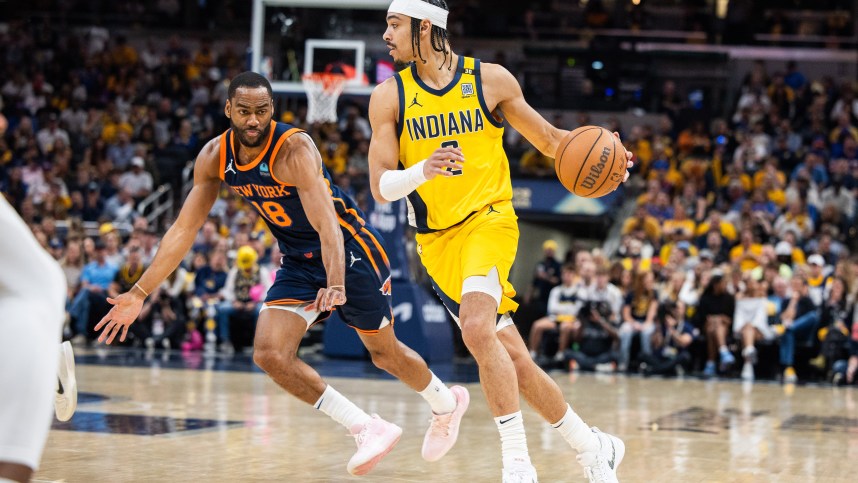 May 12, 2024; Indianapolis, Indiana, USA;  Indiana Pacers guard Andrew Nembhard (2) dribbles the ball while  New York Knicks guard Alec Burks (18) defends during game four of the second round for the 2024 NBA playoffs at Gainbridge Fieldhouse. Mandatory Credit: Trevor Ruszkowski-USA TODAY Sports