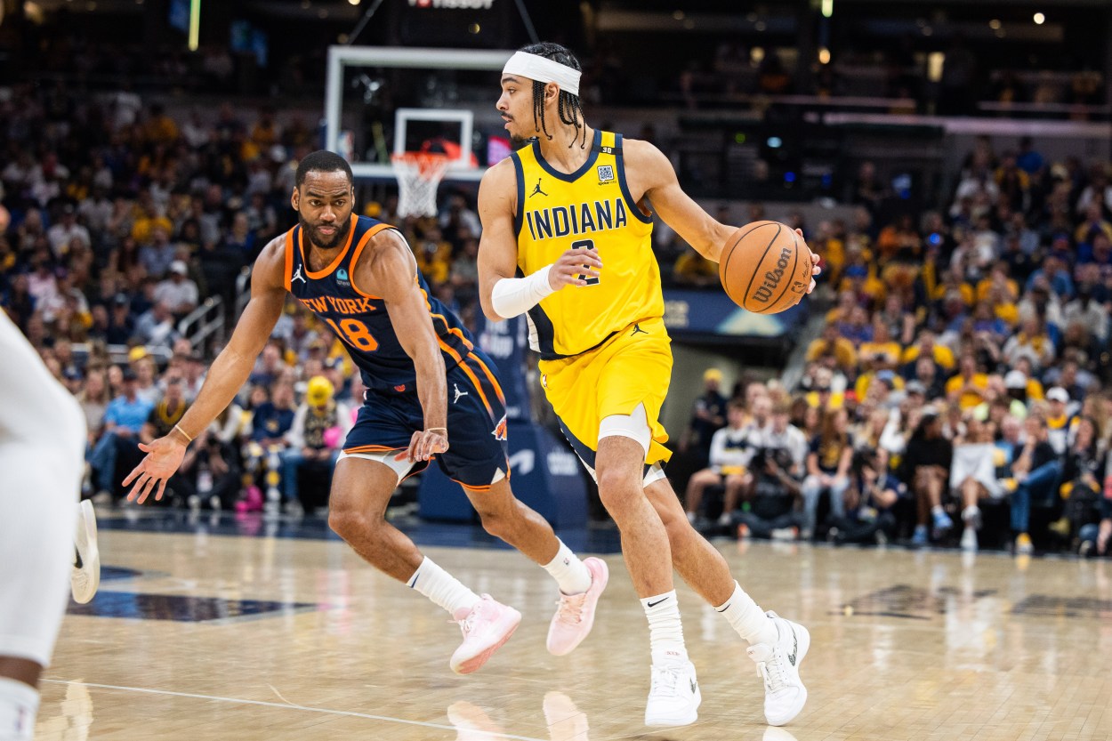 May 12, 2024; Indianapolis, Indiana, USA;  Indiana Pacers guard Andrew Nembhard (2) dribbles the ball while  New York Knicks guard Alec Burks (18) defends during game four of the second round for the 2024 NBA playoffs at Gainbridge Fieldhouse. Mandatory Credit: Trevor Ruszkowski-USA TODAY Sports