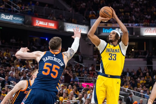 May 12, 2024; Indianapolis, Indiana, USA; Indiana Pacers center Myles Turner (33) shoots the ball while New York Knicks center Isaiah Hartenstein (55) defends during game four of the second round for the 2024 NBA playoffs at Gainbridge Fieldhouse. Mandatory Credit: Trevor Ruszkowski-USA TODAY Sports
