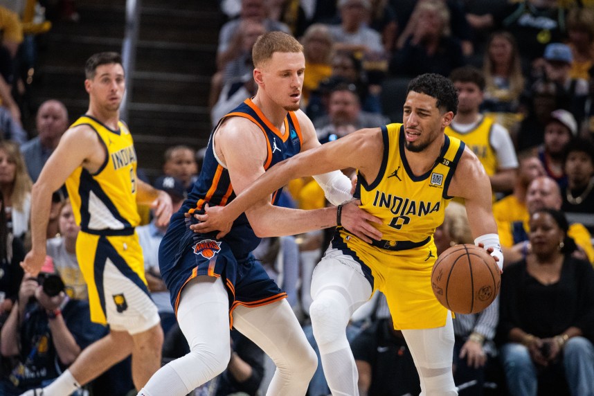 May 12, 2024; Indianapolis, Indiana, USA;  Indiana Pacers guard Tyrese Haliburton (0) dribbles the ball while New York Knicks guard Donte DiVincenzo (0) defends during game four of the second round for the 2024 NBA playoffs at Gainbridge Fieldhouse. Mandatory Credit: Trevor Ruszkowski-USA TODAY Sports