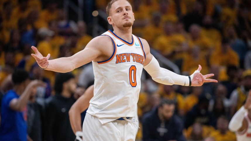 May 17, 2024; Indianapolis, Indiana, USA; New York Knicks guard Donte DiVincenzo (0) reacts after a made basket during game six of the second round for the 2024 NBA playoffs against the Indiana Pacers at Gainbridge Fieldhouse. Mandatory Credit: Trevor Ruszkowski-USA TODAY Sports