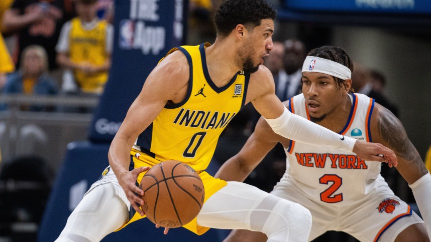 May 17, 2024; Indianapolis, Indiana, USA; Indiana Pacers guard Tyrese Haliburton (0) dribbles the ball while New York Knicks guard Miles McBride (2) defends during game six of the second round for the 2024 NBA playoffs at Gainbridge Fieldhouse. Mandatory Credit: Trevor Ruszkowski-USA TODAY Sports