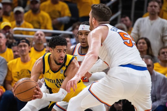 May 17, 2024; Indianapolis, Indiana, USA; Indiana Pacers guard Tyrese Haliburton (0) looks to pass the ball while New York Knicks guard Miles McBride (2) defends during game six of the second round for the 2024 NBA playoffs at Gainbridge Fieldhouse. Mandatory Credit: Trevor Ruszkowski-USA TODAY Sports