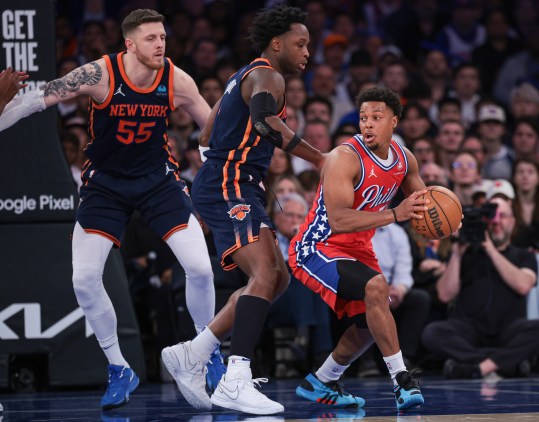 Apr 22, 2024; New York, New York, USA;  Philadelphia 76ers guard Kyle Lowry (7) is guarded by New York Knicks forward OG Anunoby (8) and center Isaiah Hartenstein (55) during the second half during game two of the first round for the 2024 NBA playoffs at Madison Square Garden. Mandatory Credit: Vincent Carchietta-USA TODAY Sports