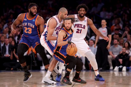 Apr 30, 2024; New York, New York, USA; New York Knicks guard Jalen Brunson (11) handles the ball against Philadelphia 76ers forward Nicolas Batum (40) and center Joel Embiid (21) during the first quarter of game 5 of the first round of the 2024 NBA playoffs at Madison Square Garden. Mandatory Credit: Brad Penner-USA TODAY Sports