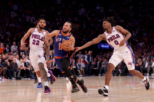 Apr 30, 2024; New York, New York, USA; New York Knicks guard Jalen Brunson (11) drives to the basket against Philadelphia 76ers guards Cameron Payne (22) and Tyrese Maxey (0) during the fourth quarter of game 5 of the first round of the 2024 NBA playoffs at Madison Square Garden. Mandatory Credit: Brad Penner-USA TODAY Sports