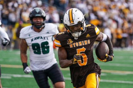 Nov 18, 2023; Laramie, Wyoming, USA; Wyoming Cowboys wide receiver Ayir Asante (New York Giants) (5) scores a touchdown against the Hawaii Rainbow Warriors during the second quarter at Jonah Field at War Memorial Stadium. Mandatory Credit: Troy Babbitt-USA TODAY Sports