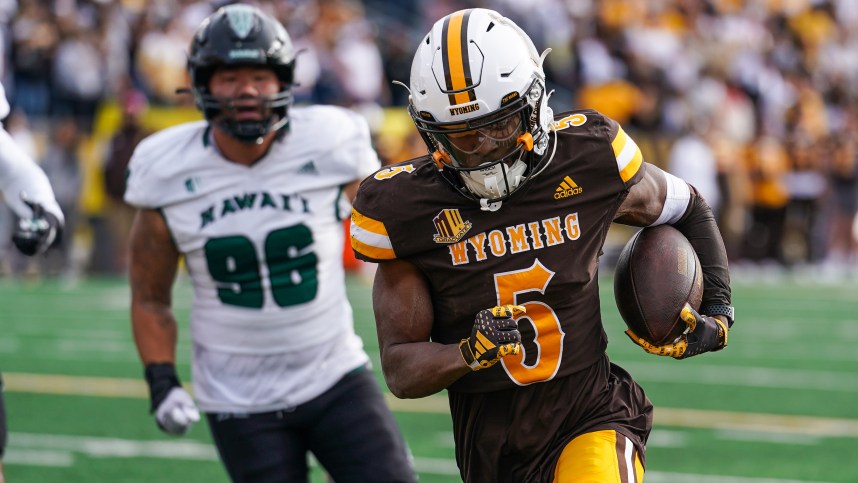 Nov 18, 2023; Laramie, Wyoming, USA; Wyoming Cowboys wide receiver Ayir Asante (New York Giants) (5) scores a touchdown against the Hawaii Rainbow Warriors during the second quarter at Jonah Field at War Memorial Stadium. Mandatory Credit: Troy Babbitt-USA TODAY Sports