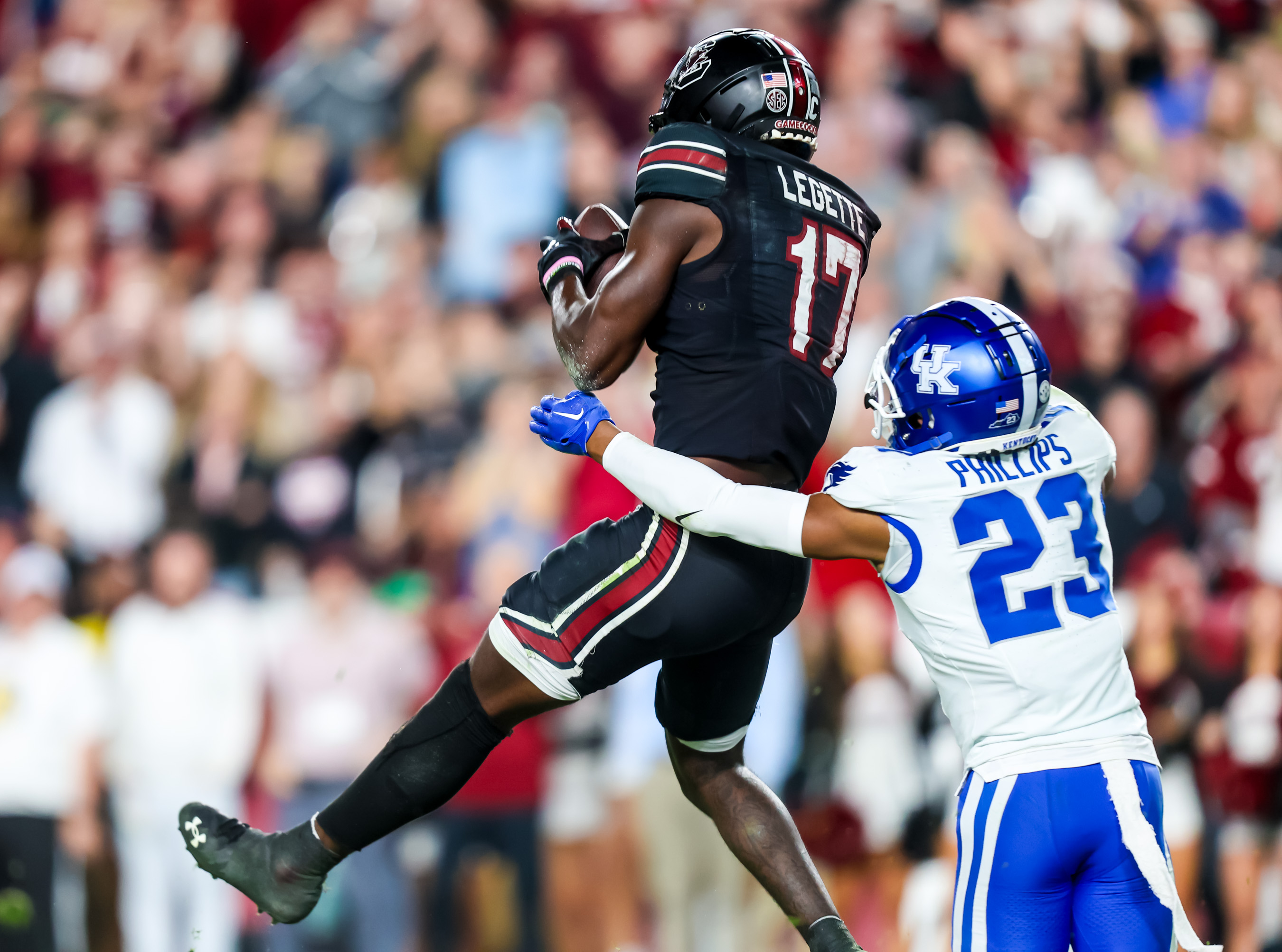 Nov 18, 2023; Columbia, South Carolina, USA; South Carolina Gamecocks wide receiver Xavier Legette (17) makes a touchdown reception over Kentucky Wildcats defensive back Andru Phillips (New York Giants) (23) in the second half at Williams-Brice Stadium. Mandatory Credit: Jeff Blake-USA TODAY Sports Kentucky